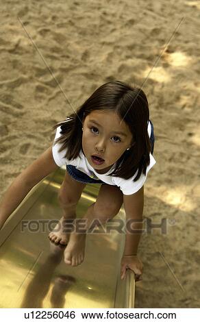 Girl on playground View Large Photo Image Stock Photograph - Girl on playground. Fotosearch