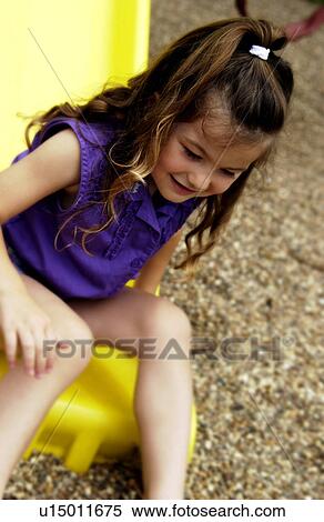 Stock Photography - Girl on slide. Fotosearch