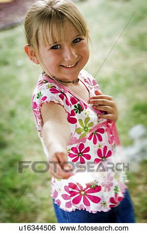 Stock Photograph - Girl with a sparkler. Fotosearch