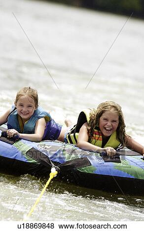 Girls Tubing View Large Photo Image Stock Photo - Girls Tubing. Fotosearch