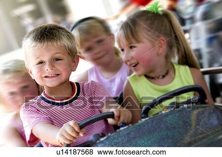 Kids on carnival ride View Large Photo Image Stock Photo - Kids on carnival ride. Fotosearch