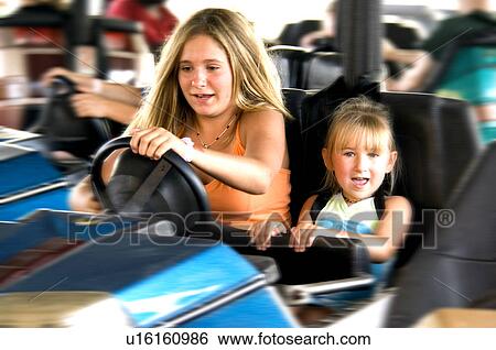 Kids on carnival ride View Large Photo Image Stock Photograph - Kids on carnival ride. Fotosearch