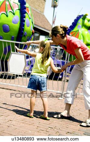 Mother and daughter at carnival View Large Photo Image Stock Image - Mother and daughter at carnival. Fotosearch