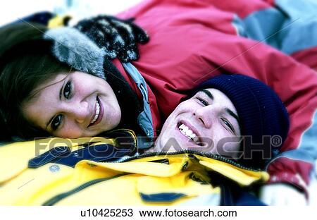 Stock Image - Couple in snow. Fotosearch