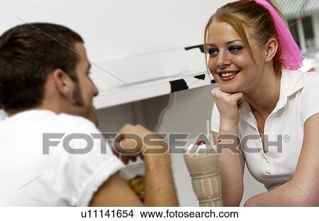 Couple sharing sodas View Large Photo Image Picture - Couple sharing sodas. Fotosearch