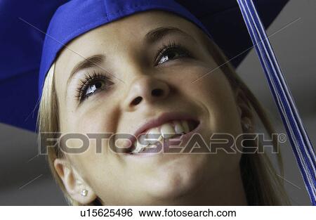 Girl in cap and gown for graduation View Large Photo Image Stock Photograph - Girl in cap and gown for graduation. Fotosearch