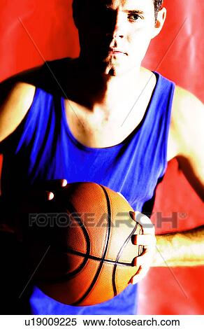 Stock Photography - Man playing basketball. Fotosearch