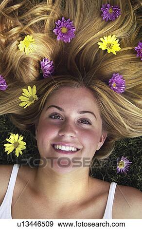 Stock Photo - Teen girl with flowers in her hair. Fotosearch
