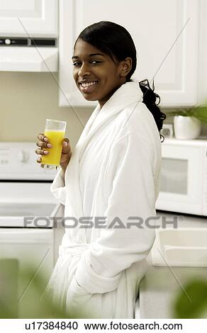 Stock Image - Woman drinking juice. Fotosearch