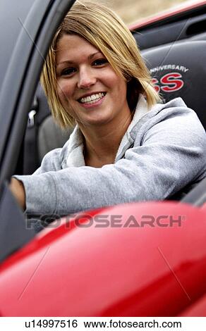Stock Photograph - Woman driving convertible. Fotosearch