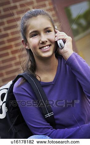 Young girl on cell phone View Large Photo Image Stock Image - Young girl on cell phone. Fotosearch