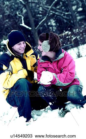 Stock Image - Couple in snow. Fotosearch