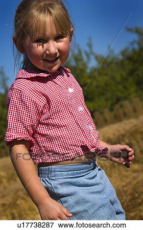 Stock Photo - Girl playing outside. Fotosearch
