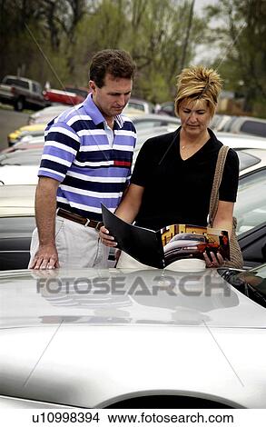 Couple car shopping View Large Photo Image Picture - Couple car shopping. Fotosearch