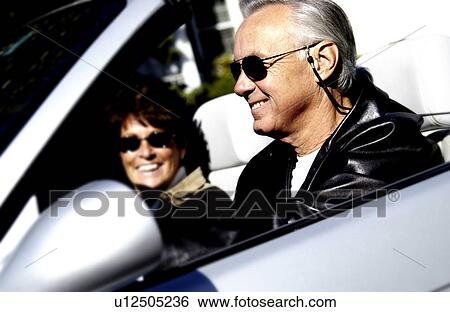 Stock Photograph - Couple in convertible. Fotosearch