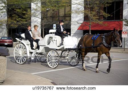 Couple on horse drawn carriage ride View Large Photo Image Stock Photo - Couple on horse drawn carriage ride. Fotosearch