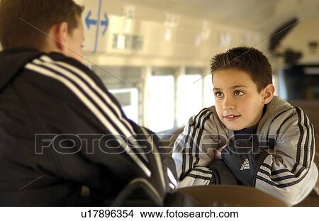 Picture - Kids on school bus. Fotosearch