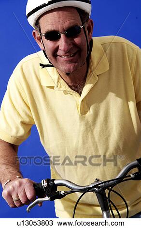 Stock Image - Man riding a bicycle. Fotosearch