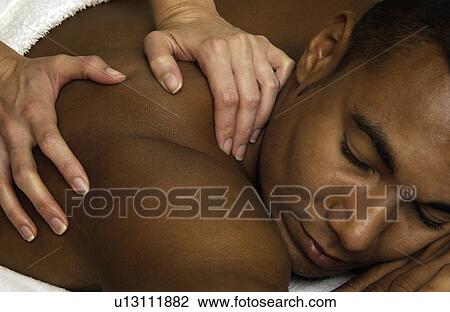 Stock Image - Man getting massage. Fotosearch