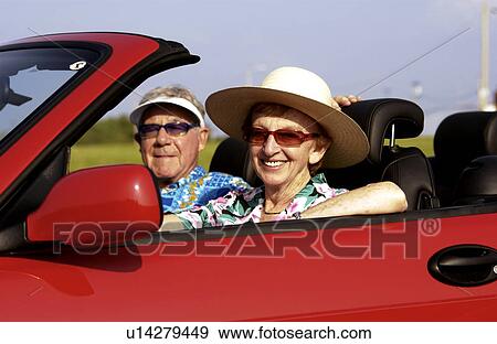 Senior couple in convertible View Large Photo Image Stock Photo - Senior couple in convertible. Fotosearch