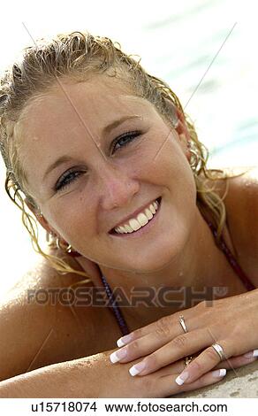 Picture - Woman in pool. Fotosearch