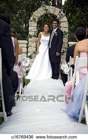 Stock Photograph - Bride and Groom at altar. Fotosearch