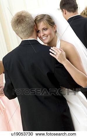 Stock Image - Bride and groom dancing. Fotosearch
