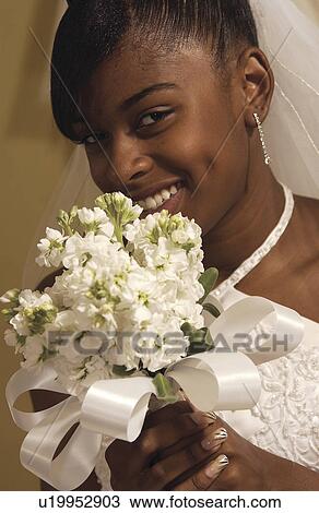 Bride holding bouquet View Large Photo Image Stock Image - Bride holding bouquet. Fotosearch