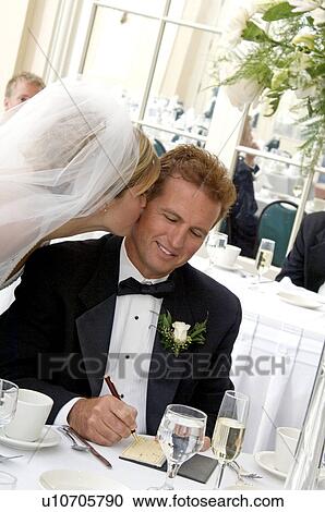 Stock Image - Bride's father writing check. Fotosearch