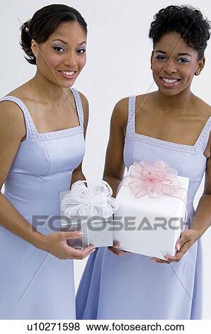 Bridesmaids holding gifts View Large Photo Image Stock Photo - Bridesmaids holding gifts. Fotosearch