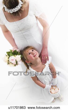 Flower girl and bride View Large Photo Image Stock Image - Flower girl and bride. Fotosearch