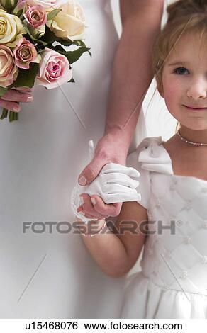 Stock Photograph - Flower girl and bride. Fotosearch
