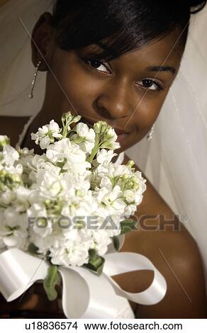 Bride holding bouquet View Large Photo Image Picture - Bride holding bouquet. Fotosearch