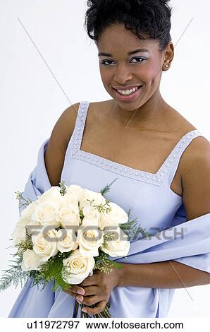 Bridesmaid holding bouquet View Large Photo Image Stock Photo - Bridesmaid holding bouquet. Fotosearch