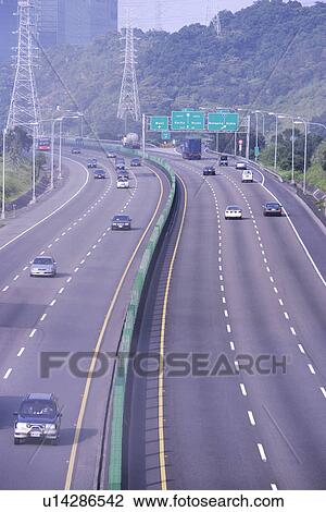 Stock Image - Drive, Outdoors, Shade trees, Bustling, Freeway, Street, Vehicle. Fotosearch