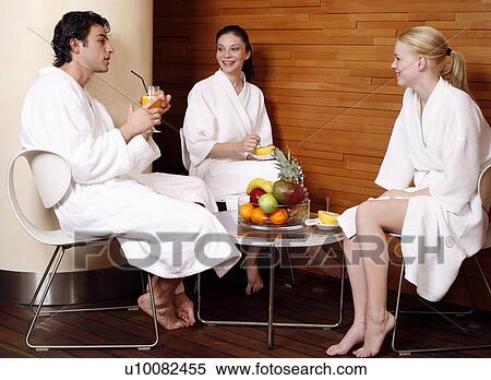 Friends having a refreshment after a spa treatment View Large Photo Image Stock Photography - Friends having a refreshment after a spa treatment. Fotosearch