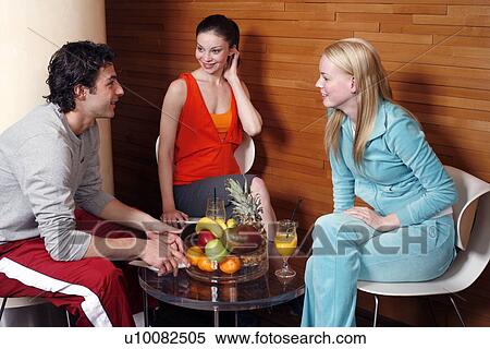 Stock Photography - Friends having a refreshment after a spa treatment. Fotosearch