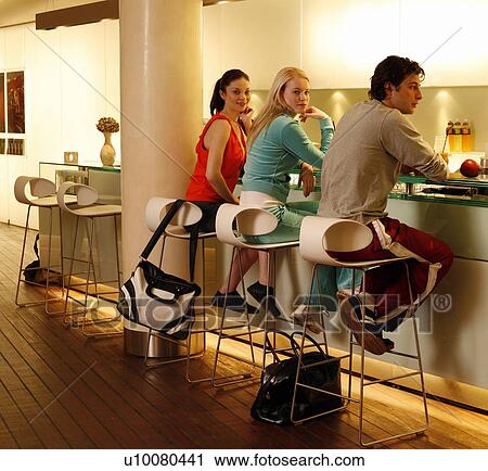 Friends having a refreshment at the bar after a spa treatment View Large Photo Image Stock Image - Friends having a refreshment at the bar after a spa treatment. Fotosearch