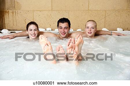 One man with two woman in jacuzzi at a spa View Large Photo Image Stock Image - One man with two woman in jacuzzi at a spa. Fotosearch