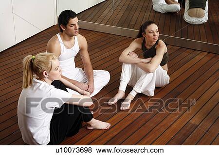 Participants waiting for the fitness class meditating View Large Photo Image Stock Photo - Participants waiting for the fitness class meditating. Fotosearch