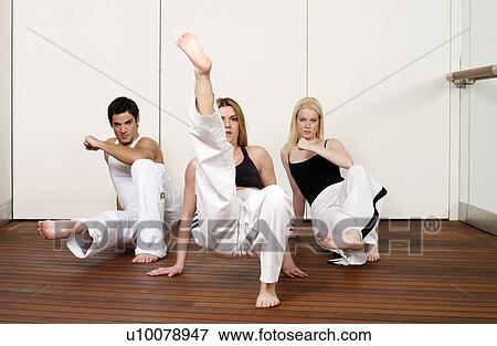 Stock Photo - Students practicing Capoeira. Fotosearch