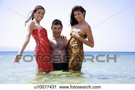 Young people posing in the water View Large Photo Image Stock Image - Young people posing in the water. Fotosearch