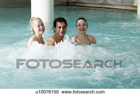 Young people swimming in spa pool View Large Photo Image Stock Image - Young people swimming in spa pool. Fotosearch