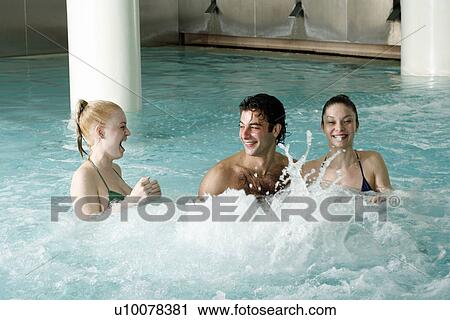 Young people swimming in spa pool View Large Photo Image Stock Image - Young people swimming in spa pool. Fotosearch