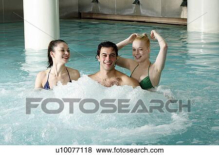 Young people swimming in spa pool View Large Photo Image Stock Photo - Young people swimming in spa pool. Fotosearch