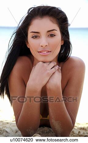 Stock Image - Closeup of young woman on beach. Fotosearch