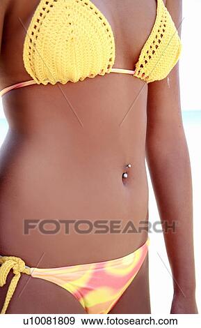 Midriff of young woman in bikini View Large Photo Image Stock Photo - Midriff of young woman in bikini. Fotosearch