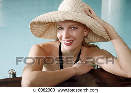 Young woman in a swimming pool at a spa View Large Photo Image Stock Image - Young woman in a swimming pool at a spa. Fotosearch