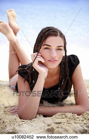 Closeup of young woman on beach View Large Photo Image Stock Image - Closeup of young woman on beach. Fotosearch