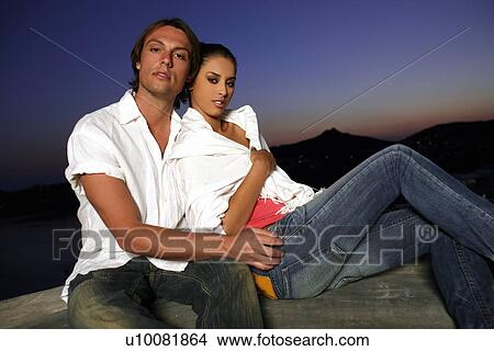 Couple sitting on terrace with a view View Large Photo Image Picture - Couple sitting on terrace with a view. Fotosearch